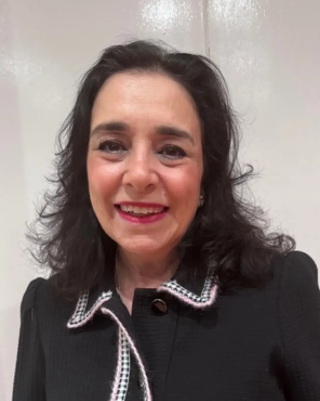 Michelle Bull Divorce Coach wearing a black dress with white detailed trim 