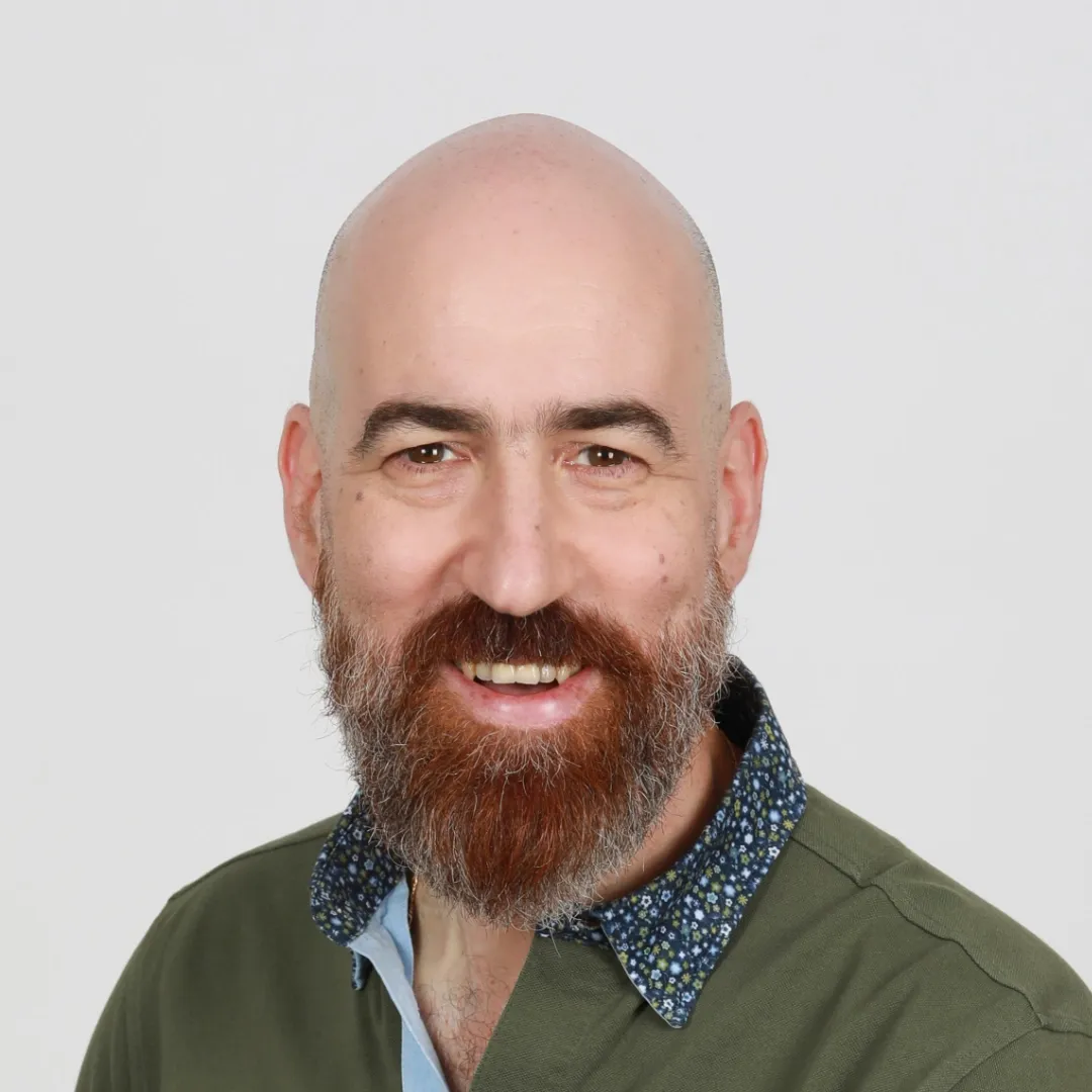 Couples Coach Eliezer Barshap smiling at the camera. 