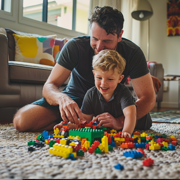 stepfather playing lego on the floor with his step son toddler